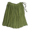 Gathered skirt in clover green with side ribbon ties & elasticized waistband, front