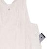 Cross back apron in natural colored European linen, pocket 1
