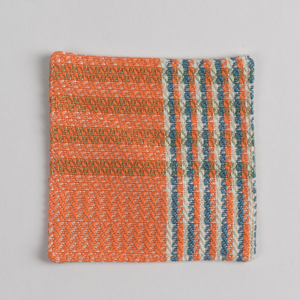 Hand woven cotton coaster - orange, front