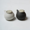 Katsufumi Baba, Sauce cruet in matt white finish & black glaze with pewter lid