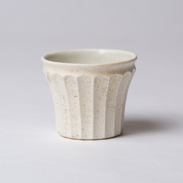 Yuko Matsuzuka, Cup with longitudinal flutes, cream glaze flecked with ochre