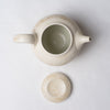 Yuko Matsuzuka, Round teapot in cream glaze flecked with ochre