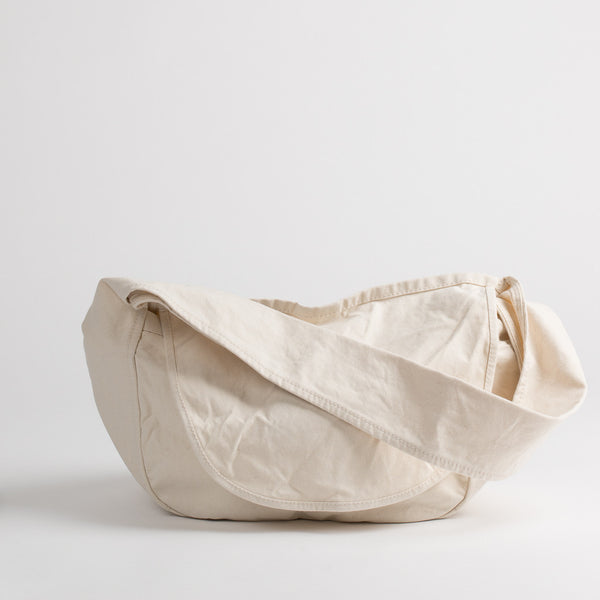 Cotton canvas messenger bag in off-white, front
